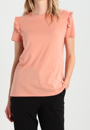 T-shirt a maniche corte color pesco con dettagli a ruches sulle spalle. Realizzato in tessuto morbido, presenta una vestibilità rilassata e scollatura rotonda.