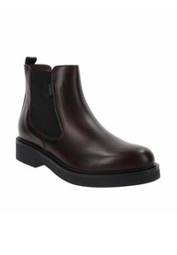 Brązowy skórzany boot chelsea z elastycznymi panelami bocznymi, zaokrąglonym noskiem i masywną czarną gumową podeszwą. Gładkie wykończenie z minimalnymi detalami w szyciu.