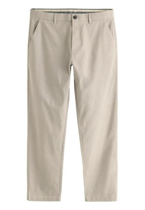 Pantaloni in cotone beige con finitura testurizzata, dotati di tasche frontali, chiusura con bottone e gamba dritta.