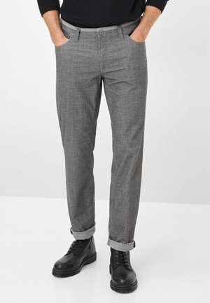 Gray patterned trousers made of lightweight fabric, featuring a straight leg, rolled cuffs, and side pockets, paired with black boots.