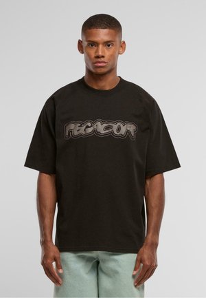 Black oversized t-shirt with a rounded neckline and raglan sleeves, featuring a large graphic logo in gray across the chest.