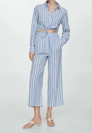 Blue and white striped cropped shirt with a knotted front and matching wide-leg trousers. The fabric is light and soft with a relaxed fit.