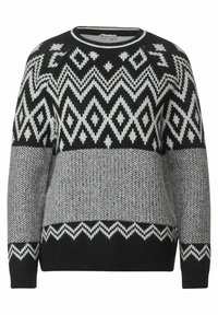 Svart och vit mönstrad tröja med geometriska mönster och horisontell ränderstruktur. Rund halsringning och långa ärmar. Mjuk stickad tyg.