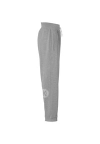 Grijze sweatpants gemaakt van zachte stof met een trekkoord in de taille, zijzakken en een subtiel logo op de onderbenen. Slim fit ontwerp.