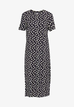 Robe midi noire à manches courtes avec un motif de pois blancs éparpillés, dotée d'un col rond.