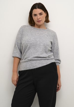 Light gray knit sweater with a relaxed fit, three-quarter sleeves, and a ribbed hem, paired with loose-fitting black pants.