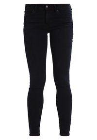 Jeans negros de corte slim con cinco bolsillos, cierre de botón y diseño de pierna ajustada.