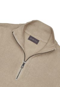 Beżowy sweter na zamek błyskawiczny z prążkowanym kołnierzem, z metalowym zamkiem i etykietą z tkaniny oznaczoną "BORCIO". Gładka dzianinowa tekstura.
