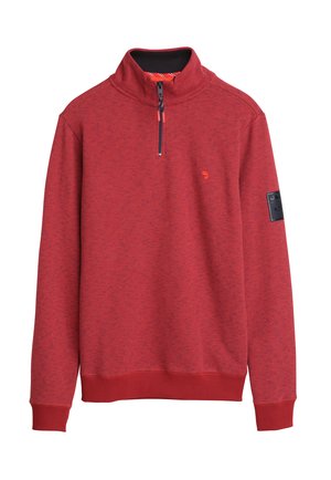 Sweatshirt zippé rouge avec un col haut, présentant un motif rayé texturé, un petit logo sur la poitrine et des poignets et un ourlet côtelés.