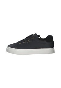 Black leather sneakers with a smooth finish, white rubber sole, and gold-tone metal eyelets. Features flat black laces and minimal branding.