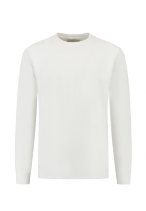 Biały, długi rękaw, koszulka z okrągłym dekoltem, wykonana z miękkiego materiału. Charakteryzuje się prostym wzornictwem bez widocznych logo ani wzorów.