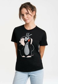 Black cotton t-shirt featuring a cartoon mole graphic with a gray belly and pink ears, set against a white background.