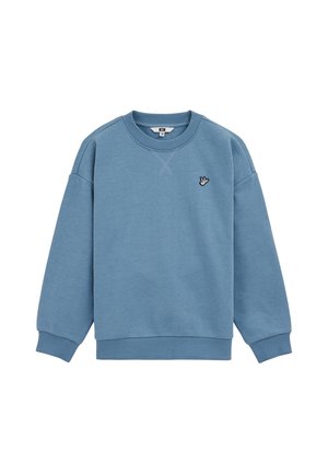 Sweat-shirt bleu col rond avec poignets et ourlet côtelés, avec un petit symbole de main brodé sur le côté gauche de la poitrine.