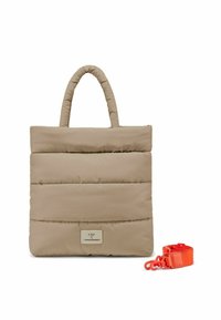 Beige padded tote bag with two handles and a detachable orange strap. Features stitched lines and a metal logo plate on the front.