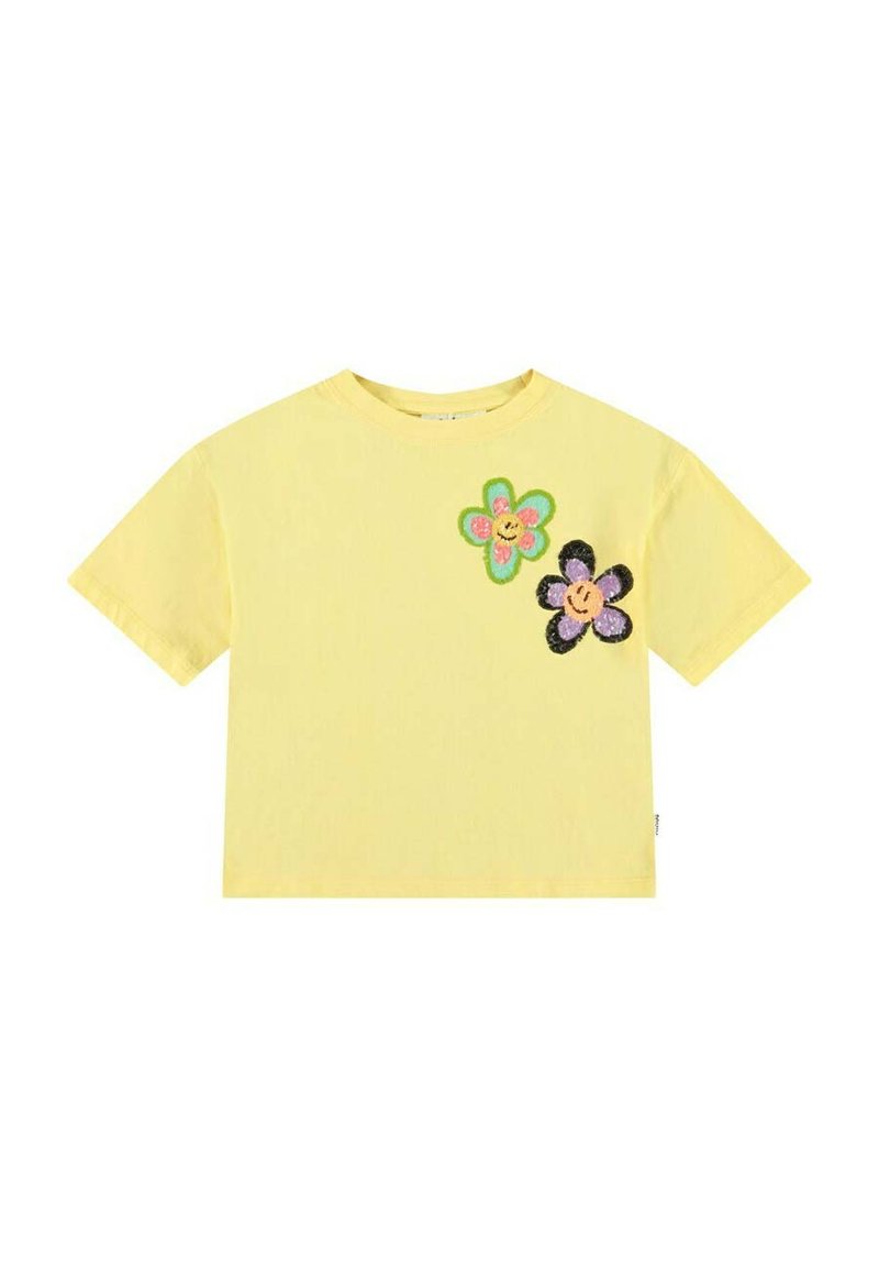 Gul bomulds T-shirt med korte ærmer, der har to farverige blomsterapplikationer i pink, grøn og sort med smilende ansigt.