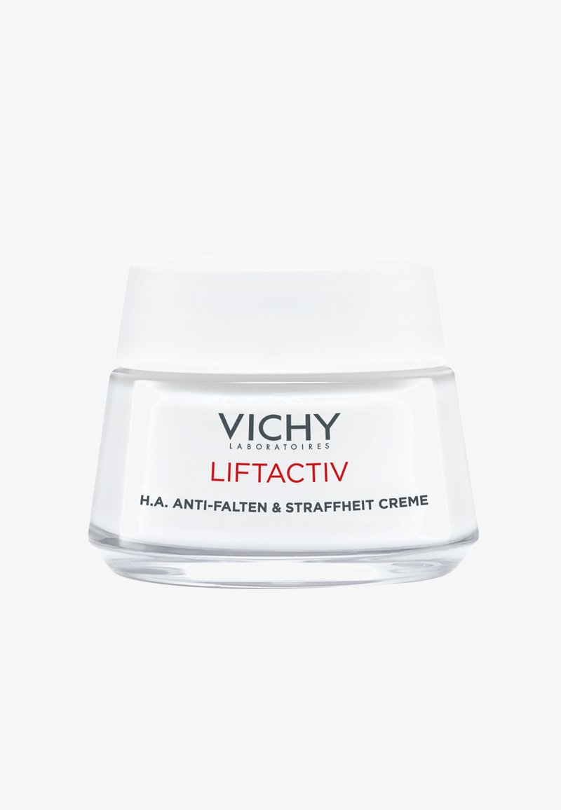 Vichy Liftactiv Creme in einem klaren Glasbehälter mit einem mattierten Deckel. Das Etikett enthält schwarze und rote Schrift, die Produkttyp und Vorteile beschreibt.