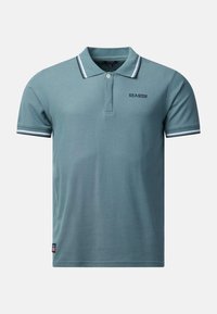 Polo à manches courtes couleur sarcelle avec col et poignets à rayures blanches et noires, patte de boutonnage, et texte "SEASIDE" sur la poitrine.
