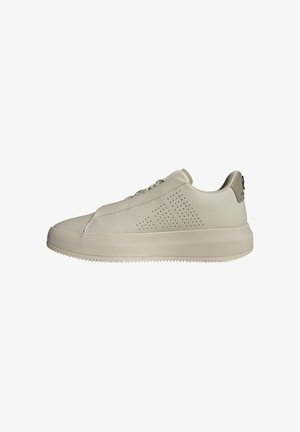 Hellebeige Sneaker aus Leder, mit durchbrochenen Mustern an der Seite, einer dicken Sohle und einem kontrastierenden Fersenakzent.