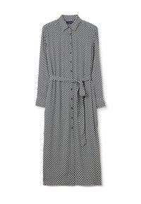 Black and white polka dot long-sleeve dress with a collared neckline, button front, and a matching belt at the waist. Soft fabric texture.