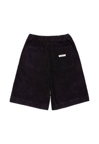 Czarne szorty z sztruksu z elastycznym pasem i dwoma naszywanymi kieszeniami z tyłu, jedna z nich z małą białą metką marki.