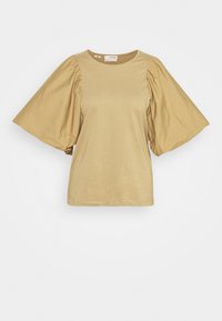 Světle béžové tričko s kulatým výstřihem a oversize nabíranými rukávy. Vyrobeno z měkké bavlny, s hladkým povrchem a minimem švů.