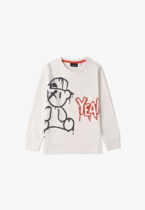 Camicia bianca a maniche lunghe con grafica di un orso nero e testo rosso "YEAH", dal taglio rilassato e polsini a costine. Materiale in cotone morbido.