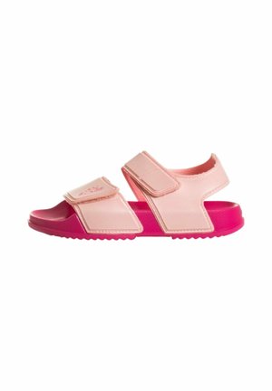 Sandalo rosa per bambino con cinturini in velcro regolabili e suola rosa vivace, mostrato di profilo su sfondo bianco.