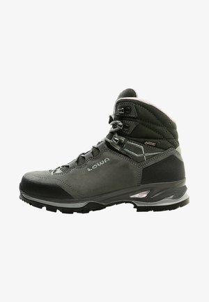 Gray hiking boot with a leather upper, reinforced toe cap, and textured rubber sole. Features lacing system and cushioned collar for support.
