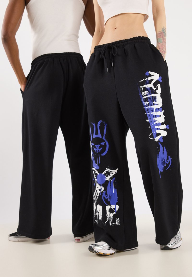 YOURTURN - UNISEX - Tracksuit bottoms - black, Enlarge