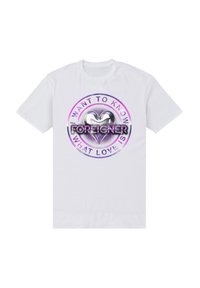 Hvid bomulds t-shirt med grafisk design, der har et sølvhjerte og tekst i sort og lilla, som siger "JEG VIL GERNE VIDE, HVAD KÆRLIGHED ER".