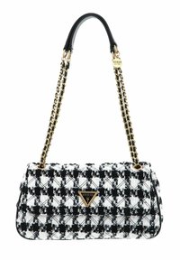 Sac en pied-de-poule noir et blanc en tissu texturé, muni d'une anse en chaîne dorée et d'une accent en métal avec logo de la marque.