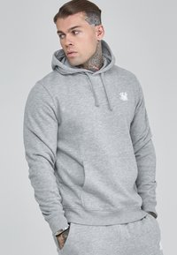 Gray cotton hoodie with a front pocket, drawstring hood, and white logo on the chest. Smooth texture and relaxed fit.