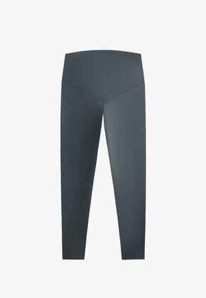 High-waisted dark grey leggings made from smooth fabric, featuring a fitted silhouette and a v-shaped seam at the back.