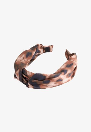 Brown and black leopard print fabric headband twisted in the center with a knotted detail on a white background.