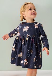 Marineblaues, langärmliges Kleid mit verspielten Tiermustern, tailliertem Bund und weichem Stoff, geeignet für Kinder.