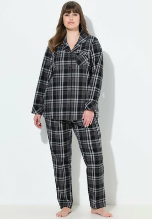 Zwart-witte geruite pyjama set met een knoopsluiting shirt met een zak en bijpassende broek. Zachte stof, relaxed fit, lange mouwen.