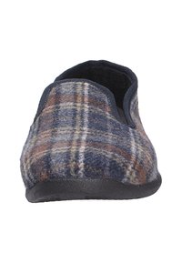 Pantofola di lana a motivo scozzese con colori navy, marrone e beige. Parte posteriore chiusa con una suola nera testurizzata, design a profilo basso.