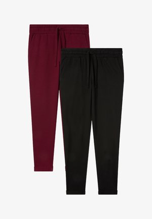 Dwie pary spodni dresowych: jedna w kolorze burgundowym, a druga czarna, obie z elastycznym pasem i mankietami, wykonane z miękkiego materiału.