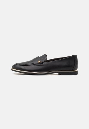 Black leather loafer featuring a rounded toe, stitched detailing, and gold accent on the vamp. Low-profile rubber sole with sleek design.