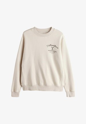 Hellbeiger Pullover mit geripptem Halsausschnitt und Bündchen, vorne mit dem dunkelbraunen Schriftzug "Yellowstone Dutton Ranch" bedruckt.
