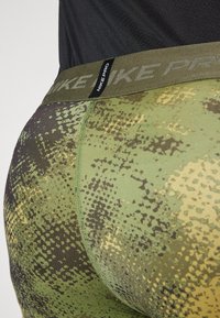 Nike Performance CAMO  - Leggings - oil green/medium olive/black