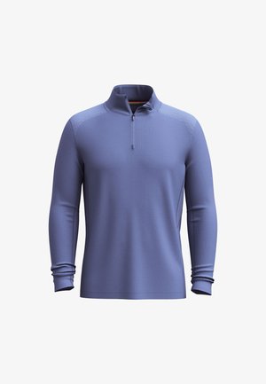 Dlouhá rukáv, pulovr na čtvrtinový zip v levandulové barvě. Vyrobeno z elastické tkaniny s hladkým povrchem a žebrovanými akcenty na ramenech a manžetách.
