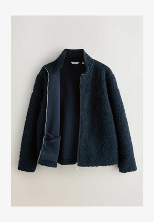Dark navy zip-up jacket with textured, fluffy outer fabric, standing collar, and inner layer of soft material. Features side pocket.