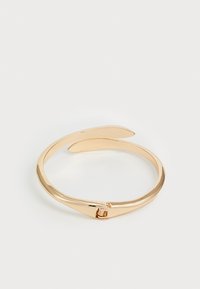 Gold-tone metal bracelet with a sleek, open design, featuring a slender band and a secure clasp detail. Smooth, reflective surface.