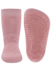 Ein Paar rosa Babysocken, eine zeigt die Oberseite und die andere die Sohle mit rutschfesten Griffen.