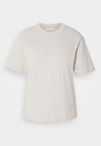 Krémové tričko s krátkým rukávem a kulatým výstřihem s diskrétním potiskem "Marc O'Polo" na hrudi.