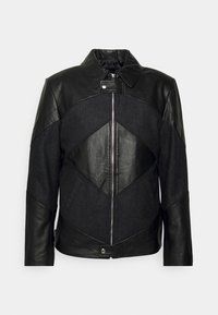 Veste en cuir noir et en laine avec un design géométrique, fermeture éclair, col montant et textures contrastées sur les manches et le corps.