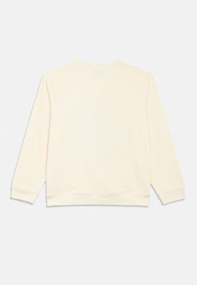 Krém színű pulóver sima textúrával, hosszú raglán ujjakkal, és bordázott nyakkivágással és szegéllyel. Simas háta extra díszítés nélkül.