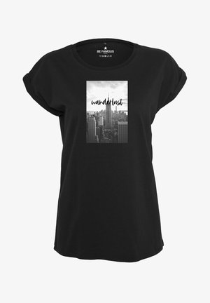 Black T-shirt with rolled short sleeves, featuring a rectangular graphic of a city skyline in black and white and the word "wanderlust" in script.