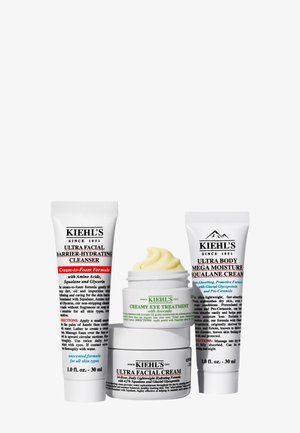 Trzy produkty do pielęgnacji skóry Kiehl’s: Ultra Facial Barrier-Hydrating Cleanser, krem do oczu z awokado, Ultra Body Mega Moisture Squalane Cream.